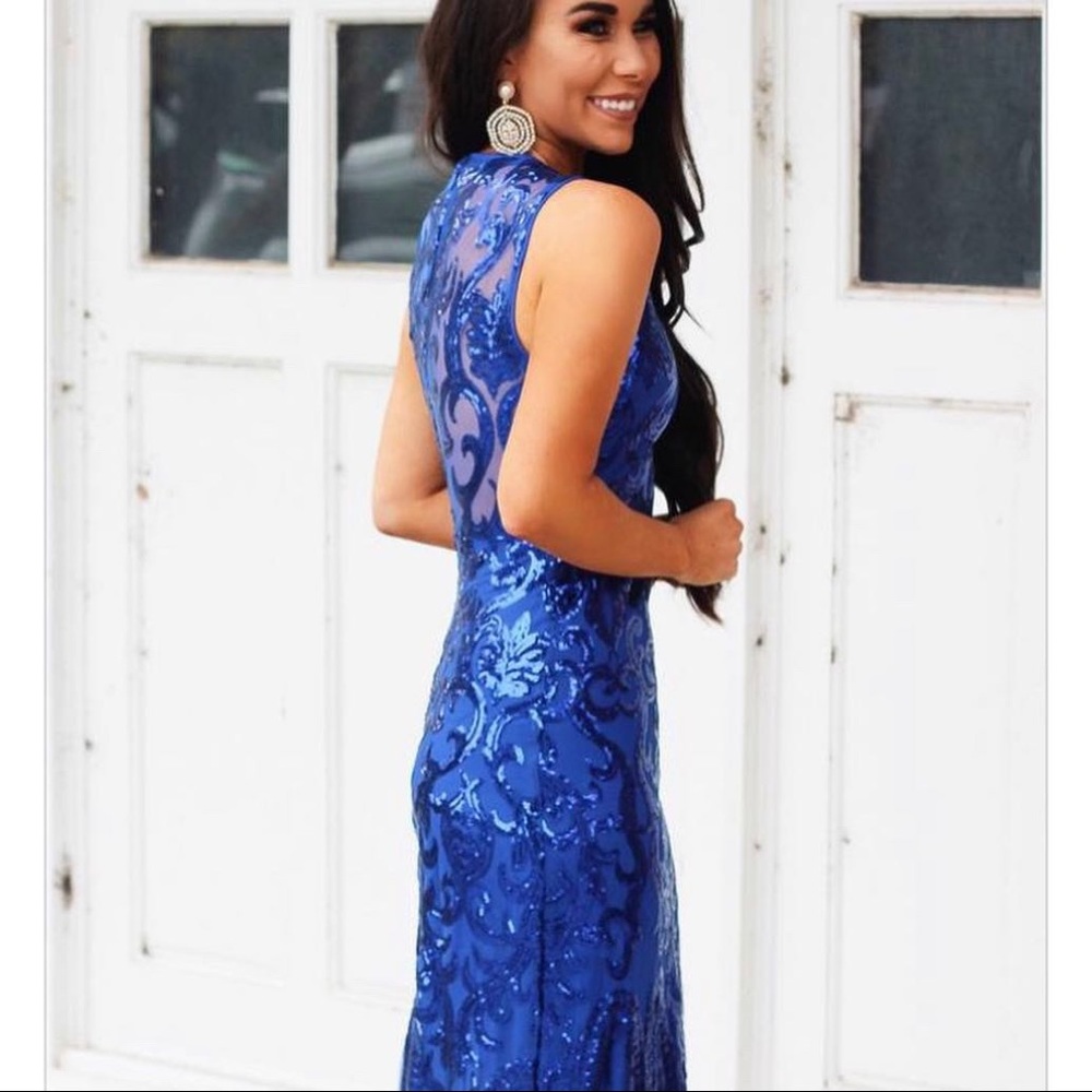 Blue sequined form fitting formal dress.